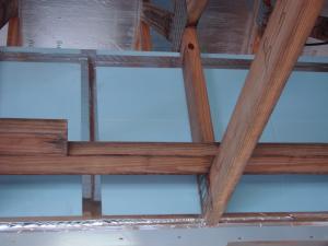 Seal bottom layer of rigid insulation with adhesive, tape and nails