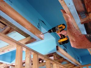 Standard 2 in. by 4 in. stud secures duct chase - made of rigid insulation in this example
