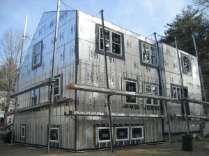 Right – This foil-faced foam sheathing has taped seams and proper flashing details so it can serve as a drainage plane.