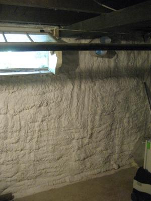 Right - Closed-cell spray foam was applied to the interior of a foundation wall.