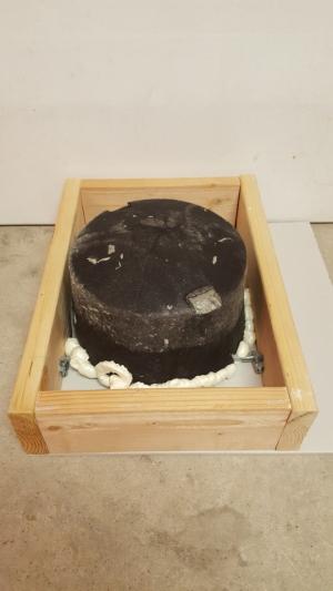 Right – The insulating enclosure over this non-IC rated recessed light fixture is centered and air sealed