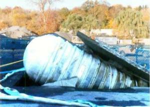 This underground storage tank in Rockaway River, NJ was lifted out of the ground by the buoyant force of flood waters