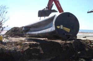 This gasoline tank collapsed due to pressure from flood waters during Hurricane Katrina, 2005, Biloxi, MS.