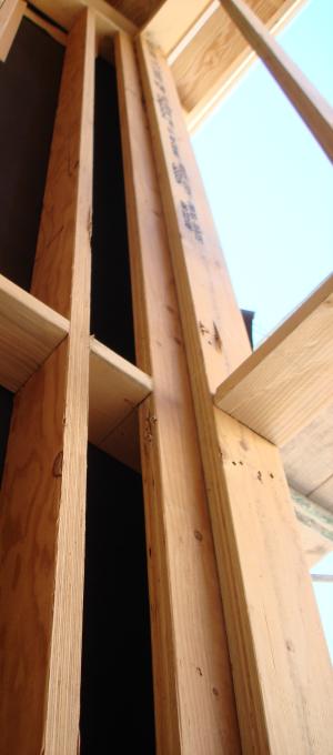 Using dry wall clips or a 1x nailer strip to avoid the third stud in corners provides more room for insulation and reduces lumber.