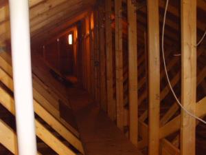 Above the 20 inches of blown cellulose ultra-efficient attic insulation, Near Zero Maine installed a walkway in the attic to provide easy access to electric wiring.