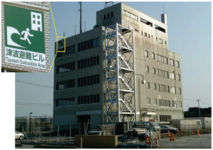 An exterior metal staircase was added to this concrete building for roof access and refuge during tsunamis in Kesennuma, Japan 