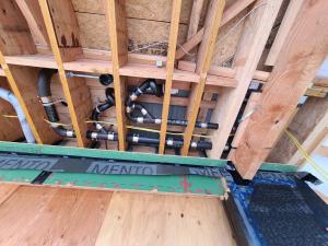 Wrong - Tub or shower floor is not insulated and air-sealed with a solid barrier material between the floor joists and the tub. Plumbing pipes shouldn't be located in a cantilever.