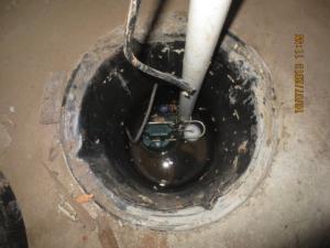 Right – A sump pump with a perforated sump pit was installed in the crawlspace slab to reduce water accumulation under the slab