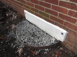 Right – This crawlspace window was completely sealed off on the inside and outside with air barrier and water-proof materials and the window well was filled in to an above-grade height to prevent bulk water from entering the crawlspace
