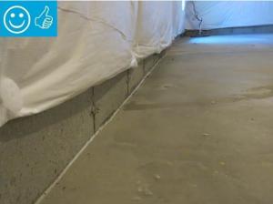 Right – The seam between the slab and the foundation wall is sealed with urethane caulk.