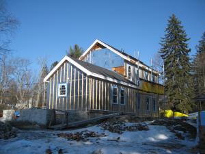 This farmhouse was retrofit by removing the existing siding and adding taped insulated sheathing and battens before installing new siding