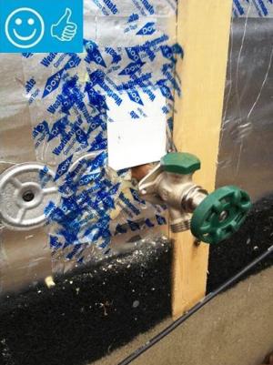 Right - The water and air control layers are properly integrated around the hose bib