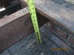 Sheathing is removed from a flat roof to retrofit with air sealing, insulation, and water control layers