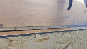 Right - Mastic is being installed to air seal the wood-to-wood joints in this wall.