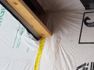 Wrong - House wrap was not properly cut and adhered where the roof meets the wall so water is likely to get behind the house wrap. 