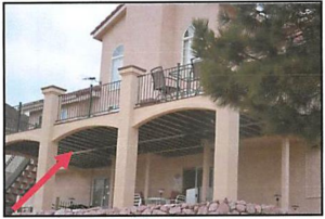 Wrong – This deck is constructed with metal railings and the wooden supports are covered with fire-resistant stucco; however, the exposed wooden beams on the underside of the deck still pose a significant fire hazard.