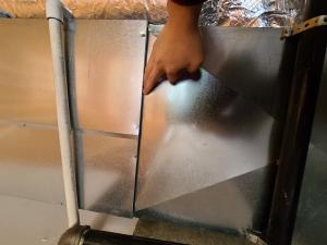 Wrong – Rips in foil air barrier behind shower were not taped; solid air barrier material is more durable.
