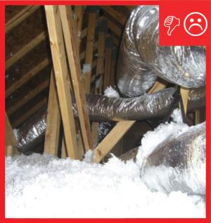 Wrong: Ducts are not laid across the lower truss cords or ceiling, but are hung from the rafters by straps. As a result, ductwork is not buried