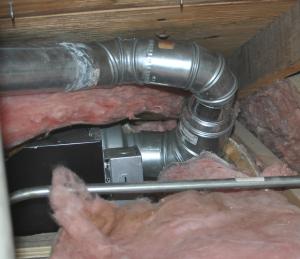 Wrong – The position of this exhaust fan does not allow the duct to route directly outside in as straight a path as possible.