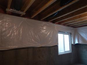 Wrong - The basement blanket insulation is loosely attached to the interior of the basement wall, does not cover the entire wall, is not sealed at the edges, and is not installed over rigid foam that covers the entire surface of the foundation walls.
