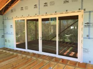 The exterior of the home is wrapped in a continuous layer of rigid foam with all seams taped to provide a thermal, air, and moisture barrier and serve as a drainage plane, eliminating the need for house wrap.