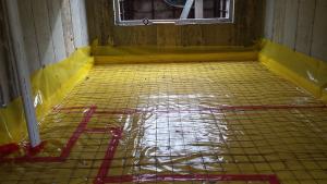 A thick vapor barrier and radon vent pipe keep soil gases out of the home.