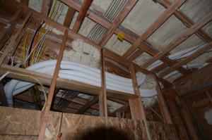 Right - The energy recovery ventilator ducts supply filtered outside air to multiple locations in the home and continuously exhaust stale air to provide clean, balanced ventilation.