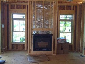 The foil-faced insulation behind this fireplace provides an air barrier and thermal shield. 