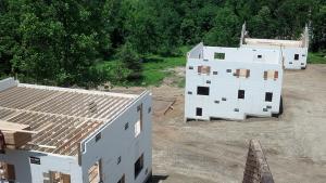 This community of production homes in central New York state was built with insulated concrete forms (ICFs), which provide a highly insulated, airtight structure that is fire-, pest-, wind-, and earthquake-resistant. 