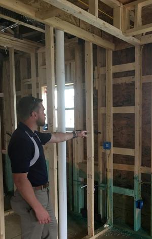 Installing ladder blocking at interior-exterior wall intersections rather than three solid studs in the exterior wall as the supporting surface allows room for insulation in the exterior wall.