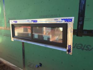 Tape flashing around windows helps to keep moisture out of the framed walls.