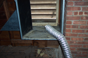 Wrong - Terminate exhaust fan ducts outdoors, not "near" the outdoors