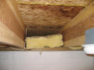 Wrong - This batt insulation is not aligned with the subfloor and joists.