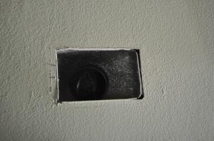 Air seal duct boot to ceiling by installing fiberglass mesh tape and mastic over seam