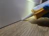 The trim-to-flooring seam can be caulked to provide an air seal at the base of the walls.