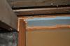 The missing top plate in a kneewall was covered with lumber and rigid foam insulation and then sealed with spray foam