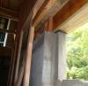 The basement walls’ interior framing is set in 3 inches from the concrete to allow space for closed-cell foam that is sprayed directly on the concrete, then blown cellulose is added to fill the wall cavity.  