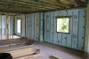 The wall’s concrete blocks are filled with foam and covered with an interior continuous thermal blanket of rigid foam insulation.  