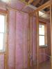 Rigid foam insulation was installed at the perimeter of the one-level apartments before installing ceiling drywall to ensure a minimum R-21 attic perimeter insulation.