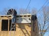 The existing 2x8 roof rafters were topped with OSB; two layers of 2-inch rigid foam; plywood; ice and water shield at rakes, eaves, and valleys; underlayment; and fiberglass shingles, plus 6 inches of open-cell foam under the decking.