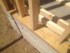 The 2x4 wall studs are staggered along the 2x6 sill plate providing space to weave insulation around each stud to stop thermal bridging through the wall.