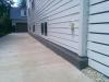 This house was designed with half of the basement above grade, allowing 36-inch-tall windows for egress and daylight on both sides of the house. 