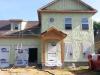 The builder installed 1.5 inches of soy-based spray foam on the outside of the walls over the OSB sheathing, then kept a ¾ inch gap between the foam and the brick veneer siding to allow moisture vapor from the bricks to dissipate.