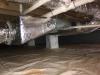 Right - the vapor barrier is extended up the sides of the piers in this crawlspace, which is sealed and insulated to house the HVAC ducts.