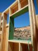 Coated sheathing is used to box the windows in this double wall.