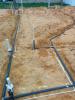 Hot water recirculation loop runs through an insulated pipe under the home’s concrete slab. 