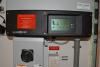 The photovoltaic system comes with a readout screen showing power production.