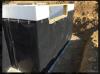 A dimpled plastic water barrier protects the insulated concrete form basement walls and carries any ground water down the walls to the footing drain to minimize the opportunity for water intrusion and frost heave.