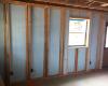 This Kalamazoo Habitat for Humanity affiliate installs one layer of foam exterior of the studs and a second layer in between the staggered studs which are set only 2 inches apart to simplify the installation of additional fiberglass batt insulation.