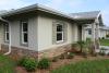 Climate-specific features include bug- and moisture-resistant concrete block construction and borate-treated interior framing; a hurricane-resistant spray-foamed hip roof; and ventless roof soffits to keep out wind-driven rain. 